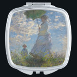 Woman with a Parasol by Claude Monet Vanity Mirror<br><div class="desc">Woman with a Parasol - Madame Monet and Her Son by Claude Monet, oil on canvas 1875, is a painting of a woman in a white dress holding an umbrella over her head upon the top of a hill covered in grass and wildflowers, backlit against a brilliant blue sky and...</div>
