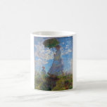 Woman with a Parasol, Monet Coffee Mug<br><div class="desc">Oscar-Claude Monet (14 November 1840 – 5 December 1926) was a French painter, a founder of French Impressionist painting and the most consistent and prolific practitioner of the movement's philosophy of expressing one's perceptions before nature, especially as applied to plein air landscape painting. The term ""Impressionism"" is derived from the...</div>
