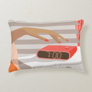 Womans hand pushing on alarm clock snooze button accent pillow
