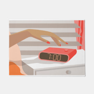 Womans hand pushing on alarm clock snooze button doormat