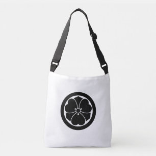 Wood sorrel with swords in circle crossbody bag