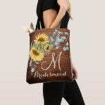 Wood Sunflower Eucalyptus Rustic Wedding Tote Bag<br><div class="desc">Give your bridal party a tote bag that'll make them feel totally flattered! These totes come customized to say anything that you'd like. For further customization, please click the "customize further" link and use our design tool to modify this template. If you need help or matching items, please contact me....</div>