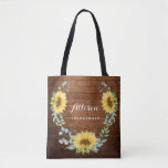 Wood Sunflower Eucalyptus Rustic Wedding Tote Bag<br><div class="desc">Give your bridal party a tote bag that'll make them feel totally flattered! These totes come customized to say anything that you'd like. For further customization, please click the "customize further" link and use our design tool to modify this template. If you need help or matching items, please contact me....</div>