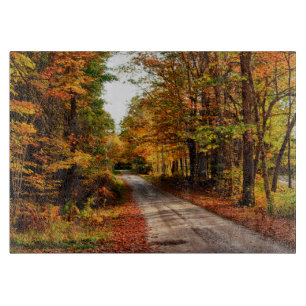 Wood trail with fall foliage cutting board