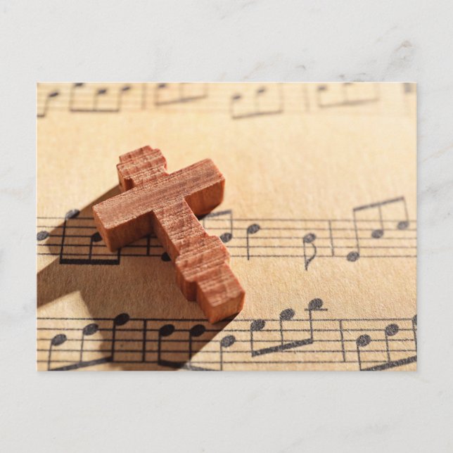 Wooden cross on sheet music paper postcard (Front)