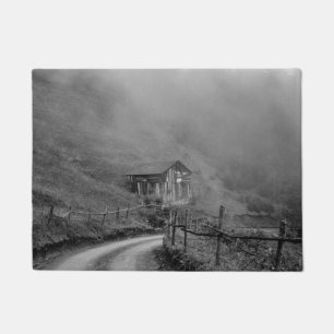 Wooden hut in nature/fog at mountain doormat
