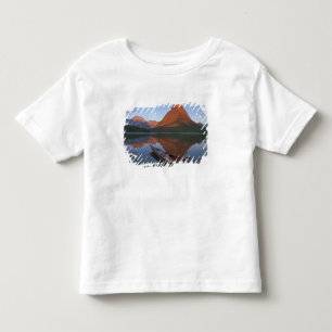 Wooden kayak in Swiftcurrent Lake at sunrise in Toddler T-shirt