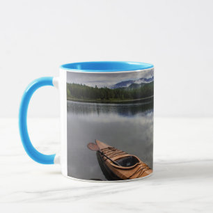 Wooden kayak on shore of Beaver Lake Mug