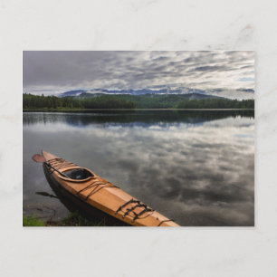Wooden kayak on shore of Beaver Lake Postcard