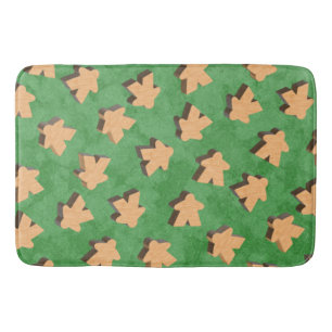 Wooden Meeples on Green Bath Mat
