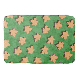 Wooden Meeples on Green Bath Mat