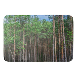 Wooden trail in pine forest bath mat