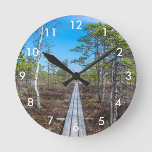 Wooden trail over swamp round clock