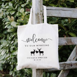 Woodland Deer Wedding Welcome Tote Bag<br><div class="desc">Welcome guests to your fall or winter wedding with these rustic chic personalized tote bags. Design features "welcome to our wedding" in a modern mix of handwritten calligraphy script and block lettering, with space to personalize with your names and date. A pair of deer (a buck and a doe) joined...</div>