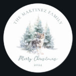 Woodland Pine Forest Wolf Merry Christmas Classic Round Sticker<br><div class="desc">A baby wolf is nestled in a winter pine forest. Merry Christmas is written in a simple script below, with an additional line below to customize the measure further. All of the text on this card can be edited. There is a Christmas message for you to personalize on the back....</div>