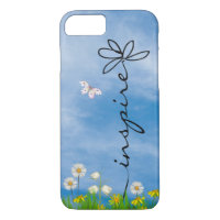 word Inspire in grass with flowers