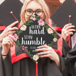 Work Hard, Stay Humble | Custom Class Year Graduation Cap Topper<br><div class="desc">Cute grad cap topper features the quote "work hard,  stay humble" in white brush script lettering on a black background adorned with pink watercolor flowers and green foliage. Personalize with your class year.</div>