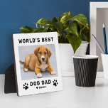 Worlds Best Dog Dad White Square Custom Photo Plaque<br><div class="desc">This simple and modern square custom photo plaque easel sign features a portrait-shaped photo space with custom "The World's Best Dog Dad" wording with name(s) of pet puppy dog(s) in modern black style with cute paw prints, heart accent, and personalization of the dog's name. Makes a great Father's Day gift...</div>