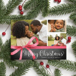 Wrapped in Red | Holiday Photo Collage Card<br><div class="desc">Festive holiday photo card features three of your favourite images adorned with a red watercolor ribbon bow illustration. "Merry Christmas" appears beneath in white lettering on a rustic chalkboard background. Personalize with your names and the year.</div>