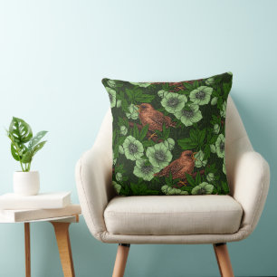 Wren and hellebore on dark green throw pillow