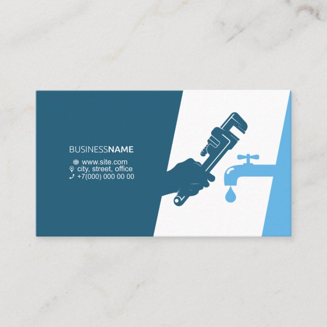 Wrench in hand of plumber business card (Front)
