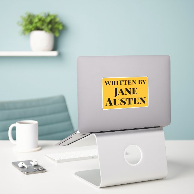 Written by Jane Austen Yellow Black Serif Text (Laptop On Desk)