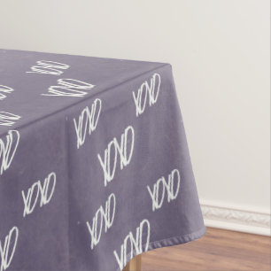 Xoxo handwriting on grey tablecloth