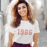 Year Birthday | Custom Coral Pink Modern Trendy T-Shirt<br><div class="desc">Stylish,  trendy "1986" custom birth year t-shirt in modern minimalist bold block college style typography in coral pink. The perfect birthday gift to celebrate your year of birth,  establishment and vintage which can be easily personalized with your own year.</div>