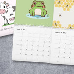 Year Illustrated Calendar<br><div class="desc">A 12 months Calendar with seasonal illustrations: a cute cow on cover, a snowy landscape with a bullfinch for January, a lemon and orange pattern for February, an outer space decor for March, a rainbow for April, a cute frog for May, a spring landscape with flowers and mountains for June,...</div>