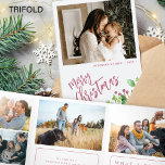 Year in review multi photo red Merry Christmas  Tri-Fold Holiday Card<br><div class="desc">Greenery holly berry foliage modern Merry Christmas red brushed script family year in review 9 photo collage gallery tri fold holiday card with your custom personalized text.</div>
