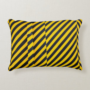Yellow and black striped textile accent pillow