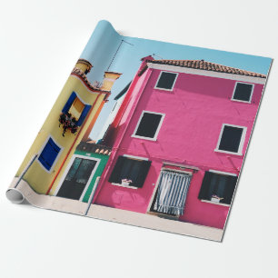 YELLOW AND PINK CONCRETE HOUSES DURING DAYTIME WRAPPING PAPER