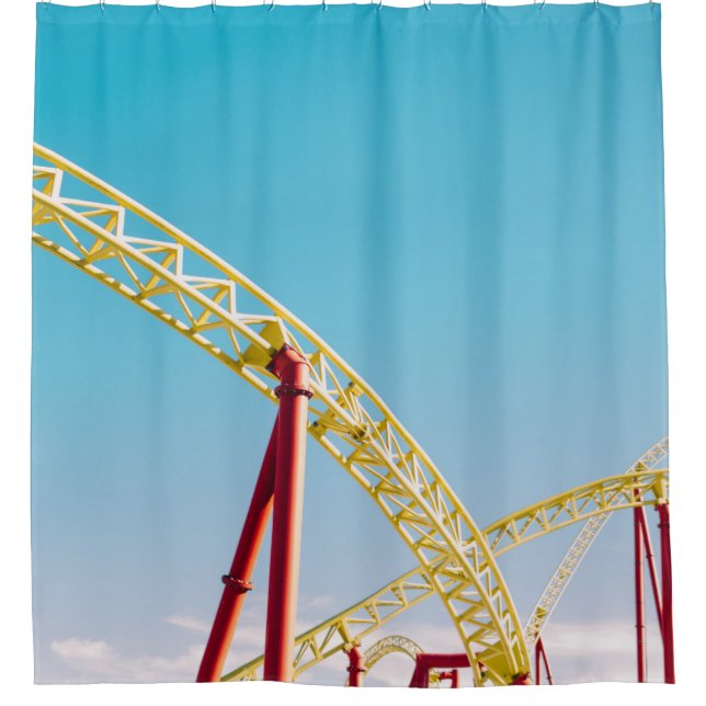 Yellow and red roller coaster under blue sky at da (Front)