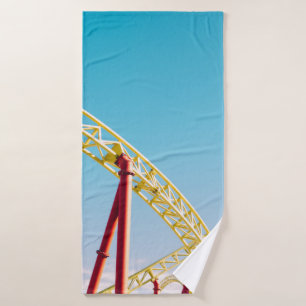 Yellow and red roller coaster under blue sky at da bath towel