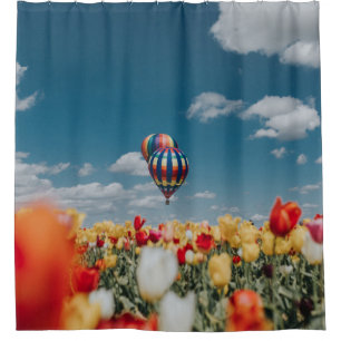 Yellow and red tulip flowers under hot air balloon