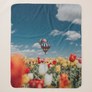 Yellow and red tulip flowers under hot air balloon sherpa blanket
