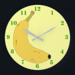 YELLOW BANANA IN POP ART STYLE WITH GREEN NUMBERS LARGE CLOCK<br><div class="desc">A light yellow Clock with green numbers,  and a digital illustration of a tropical banana. Available in other options. Visit our store for more Wall Clocks and other Home Gifts.</div>
