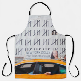 YELLOW CAB IN FRONT OF WHITE PAINTED WALL APRON