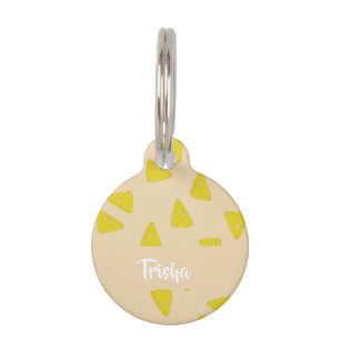 Yellow cheese shapes on pink pet tag