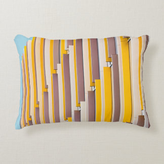 YELLOW CONCRETE BUILDING DURING DAYTIME ACCENT PILLOW