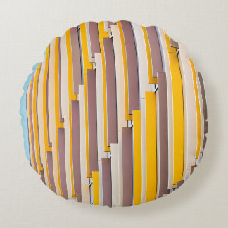 YELLOW CONCRETE BUILDING DURING DAYTIME ROUND PILLOW