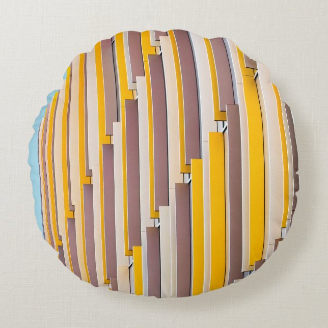 YELLOW CONCRETE BUILDING DURING DAYTIME ROUND PILLOW (Front)