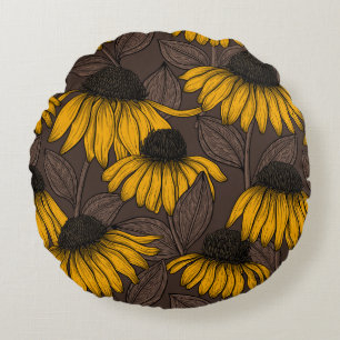 Yellow coneflowers on dark brown round pillow