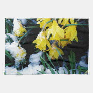 Yellow Daffodils flowers in the snow Kitchen Towel