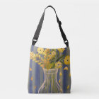 Yellow daisy cross body bag with blue background