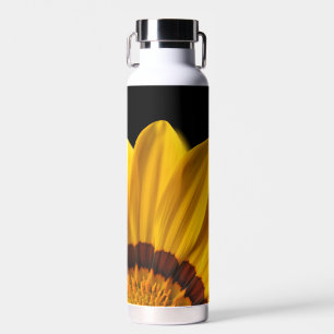 Yellow flower on black background water bottle