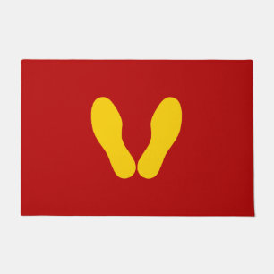 YELLOW FOOTPRINTS ON RED DOORMAT