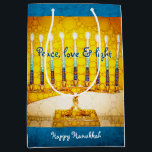 Yellow Gold Hanukkah Menorah Peace Love Light Bold Medium Gift Bag<br><div class="desc">“Peace, love & light.” A close-up photo illustration of a bright, colourful, yellow and gold artsy menorah helps you usher in the holiday of Hanukkah in style. Feel the warmth and joy of the holiday season whenever you use this cute and fun personalized medium size gift bag. Matching cards, postage,...</div>