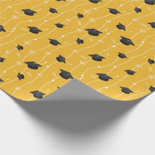 Yellow Graduation Caps and Ribbon Wrapping Paper