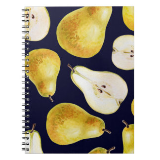 Yellow-green whole ripe pear on a black background notebook